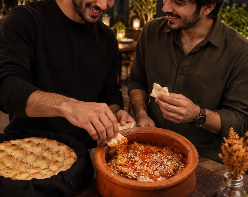 Tear, dip, repeat: Clay-pot handi with garlic naan